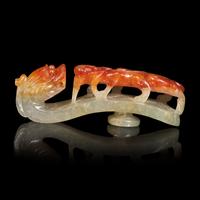 A Chinese Russet and Pale Celadon Jadeite "Dragons" Belthook 翡翠龍紋帶鉤