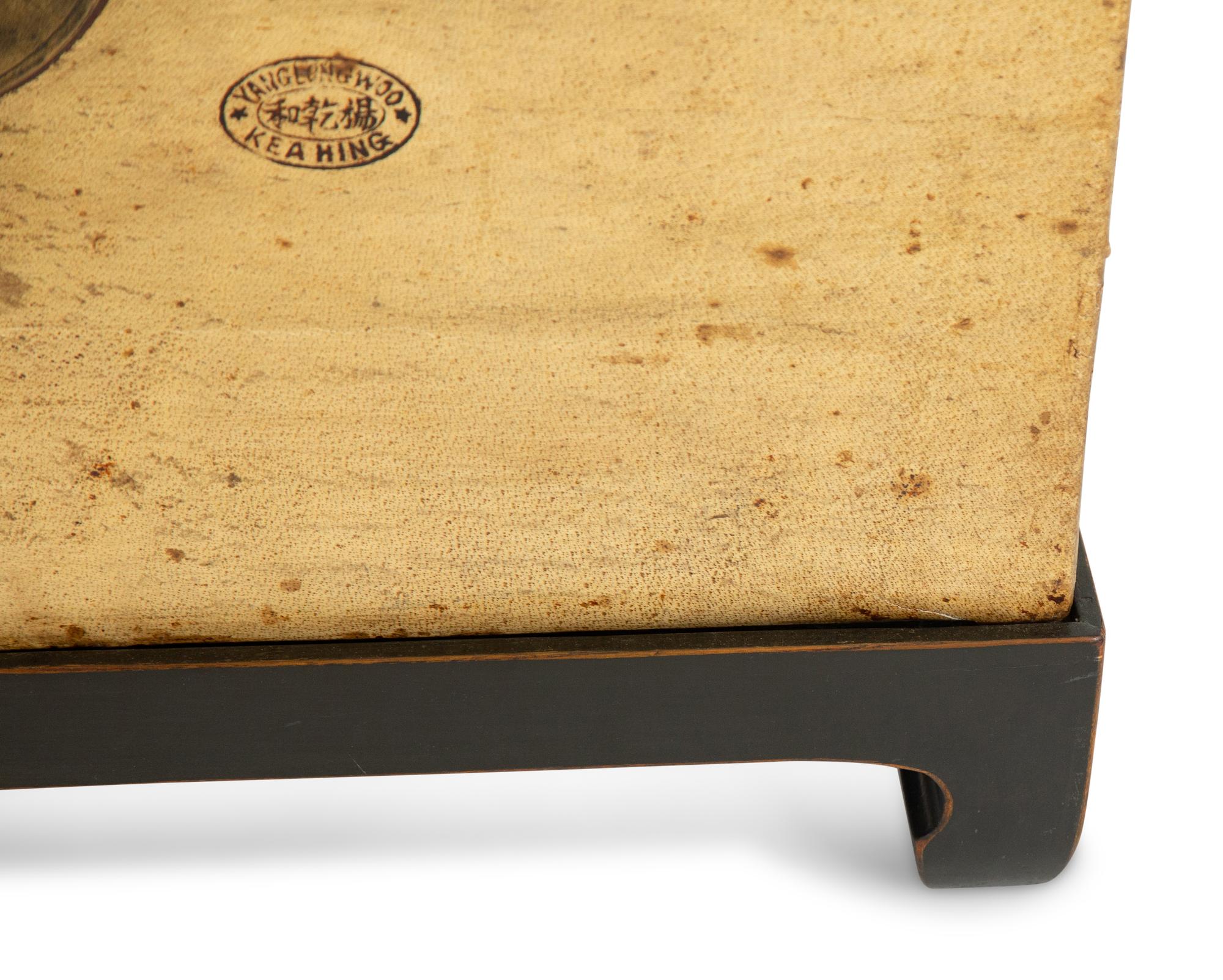 A Chinese Parchment Leather Bound Trunk with Brass Mounts and Handles