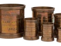 A Set of Eight English Brass Graduated Imperial Bushel Measures