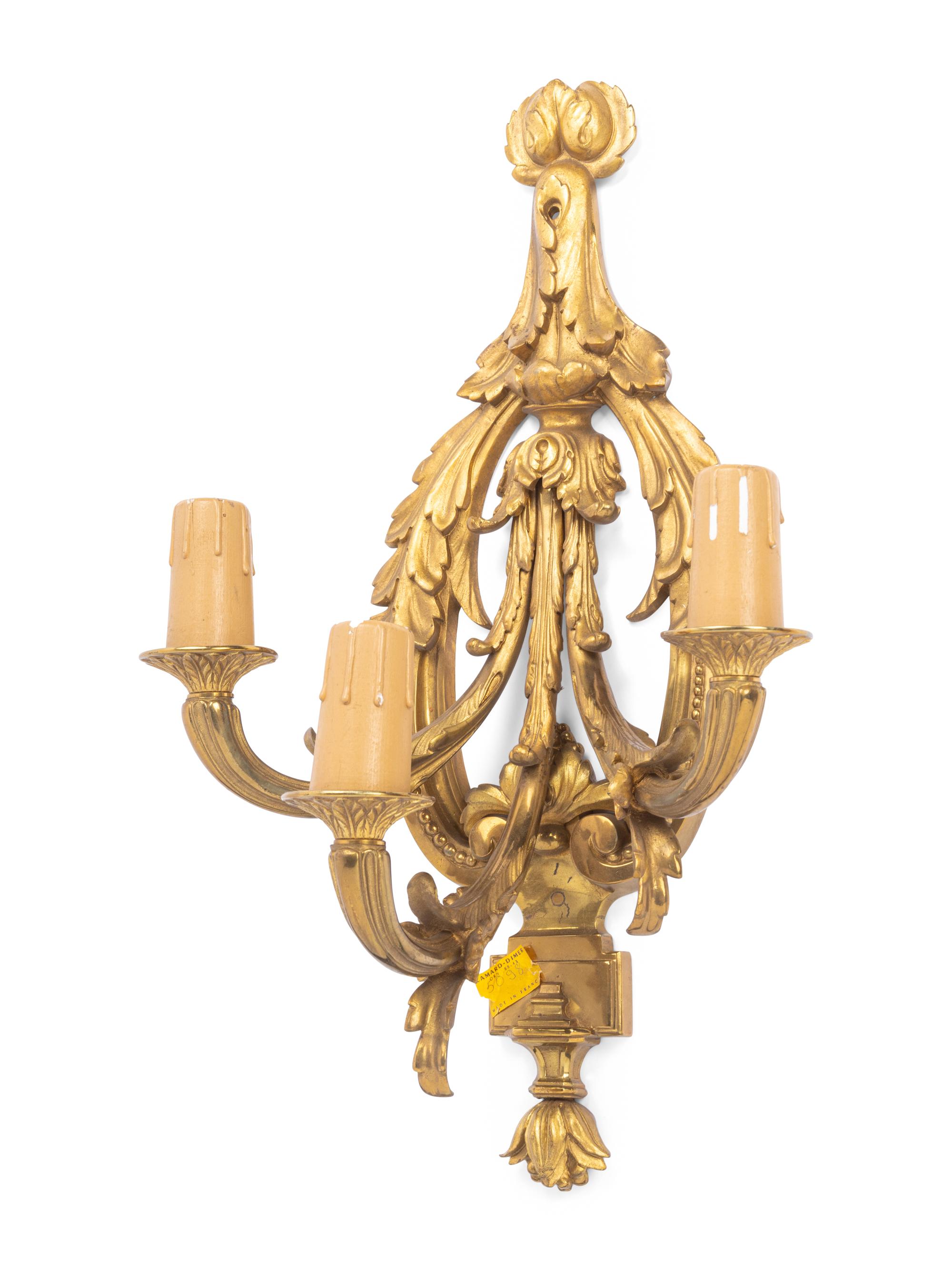 A Set of Four Louis XVI Style Gilt Metal Three-Light Sconces