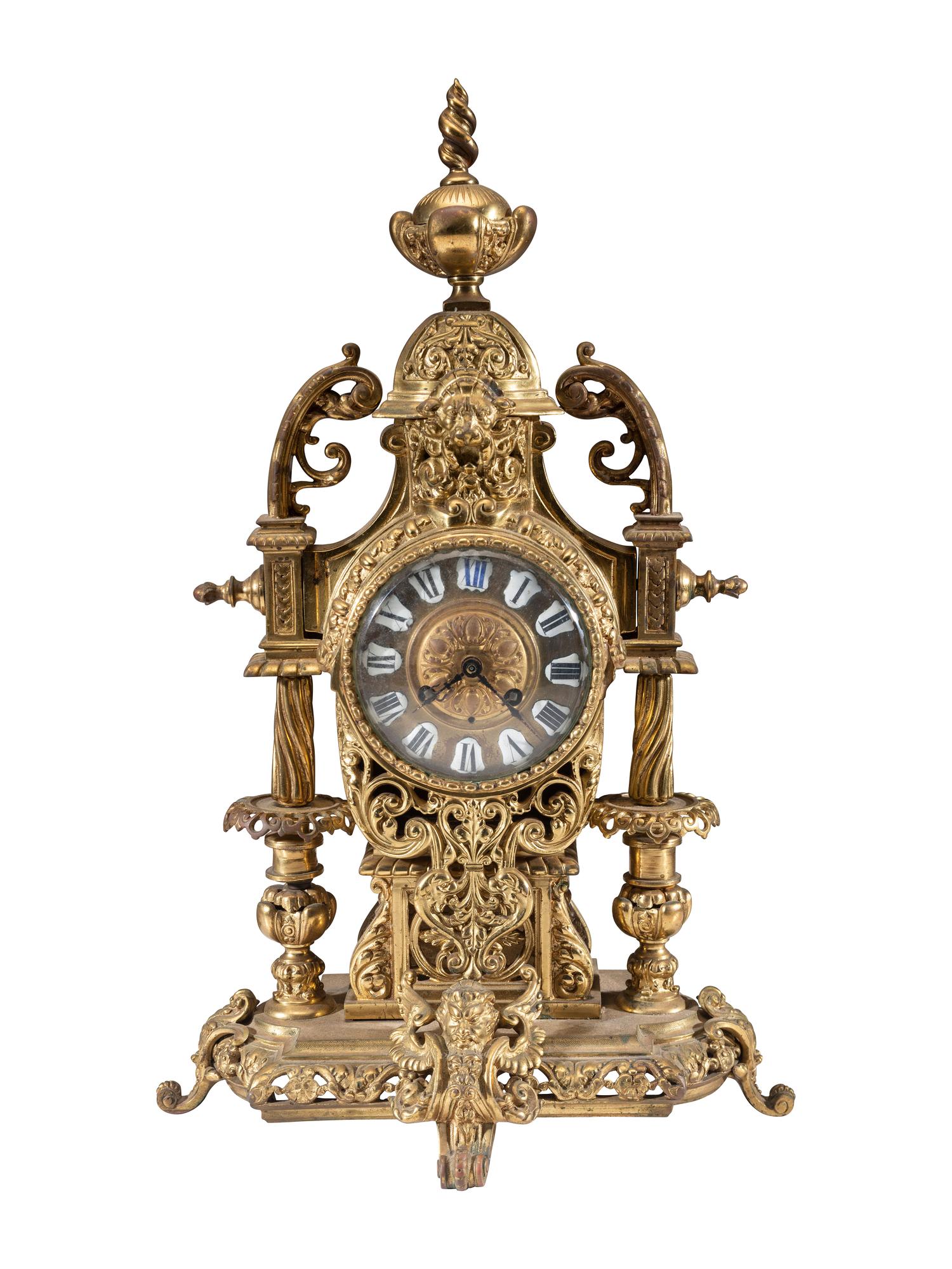A Continental Gilt Bronze Three-Piece Clock Garniture