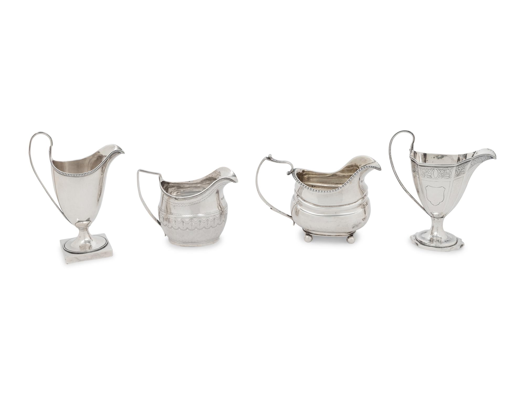 A Group of Four English Silver Creamers