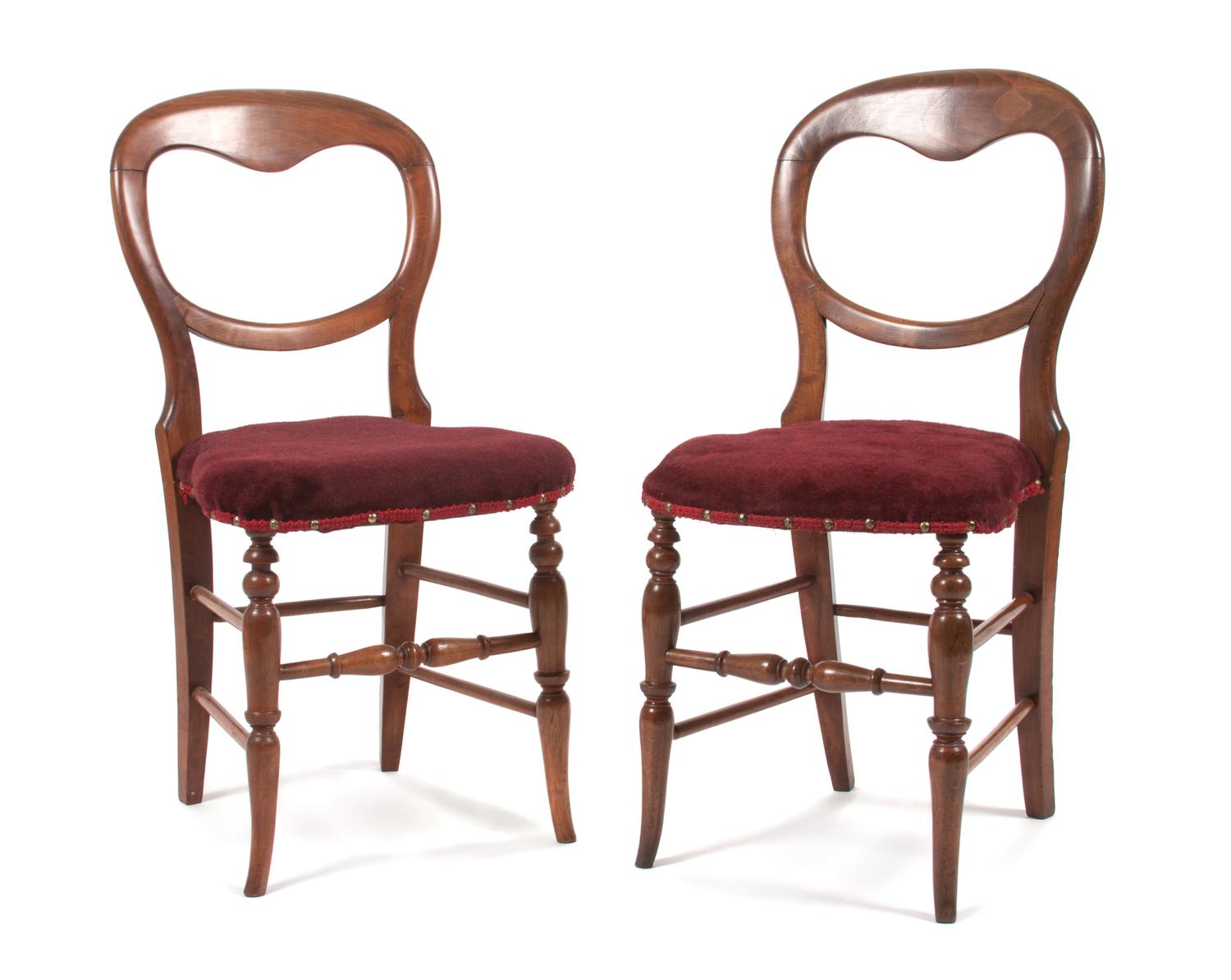 A Set of Four Victorian Balloon Back Side Chairs Height 33 1/4 inches.