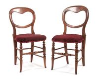 A Set of Four Victorian Balloon Back Side Chairs Height 33 1/4 inches.