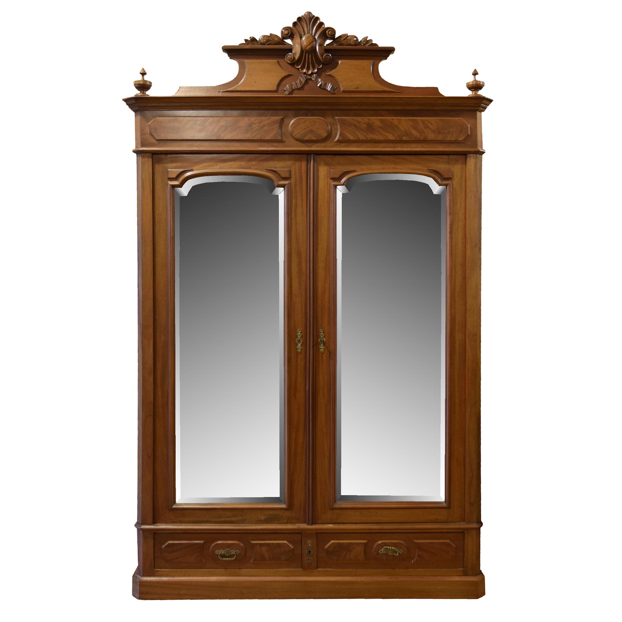 A Victorian Walnut Two Door Armoire 52" W x 22" D x 83" H — United States, Circa 1880