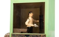 A Manikin Baker Boy Gum Vendor