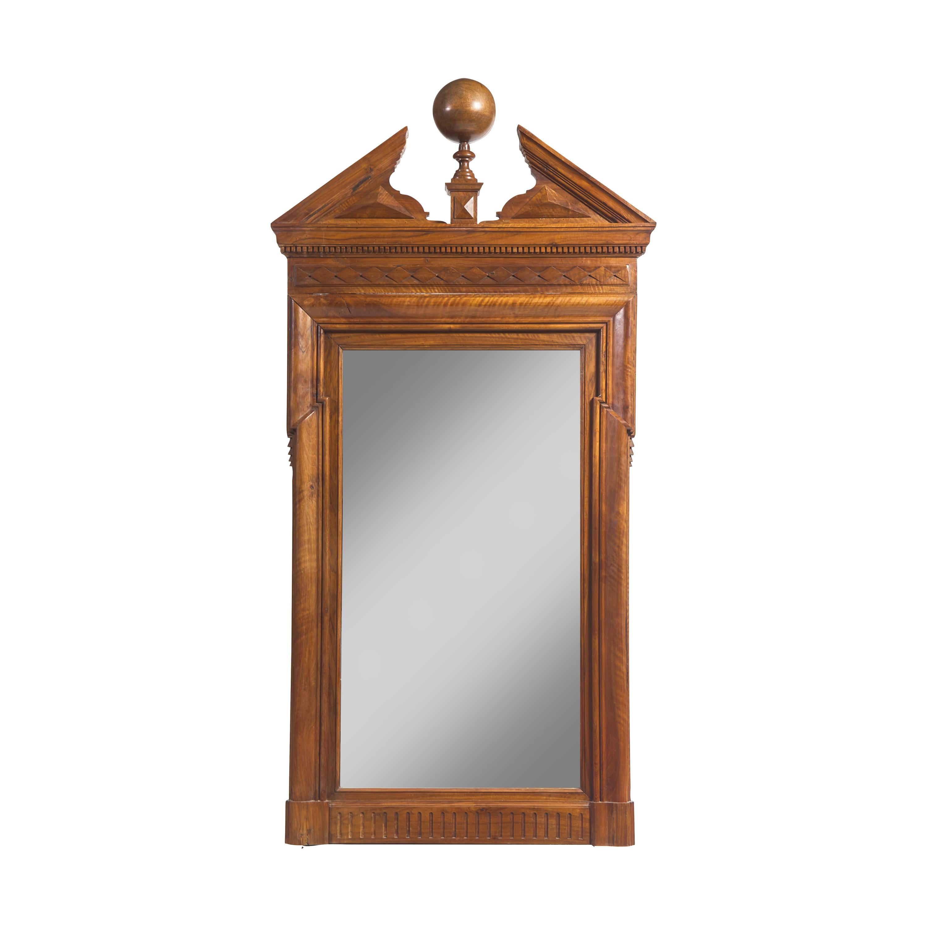 A Large Neoclassical Carved Walnut Mirror