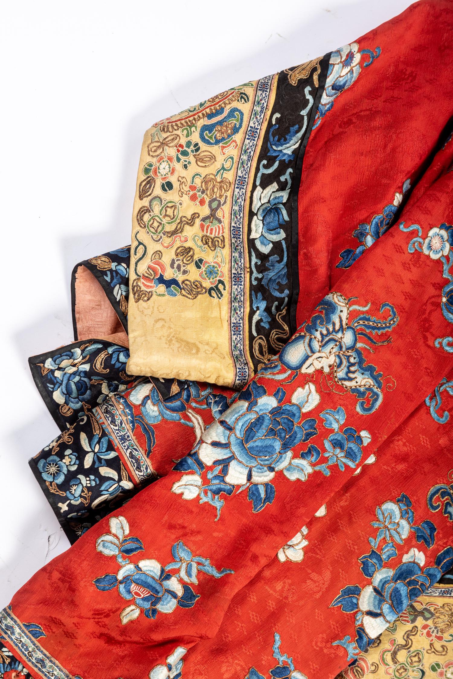 A Chinese Red Ground Embroidered Silk Lady's Robe
