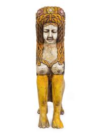 A Large Carved and Polychrome Decorated Wood Sphinx