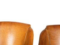 A Set of Four Leather-Upholstered Barrel-Back Armchairs