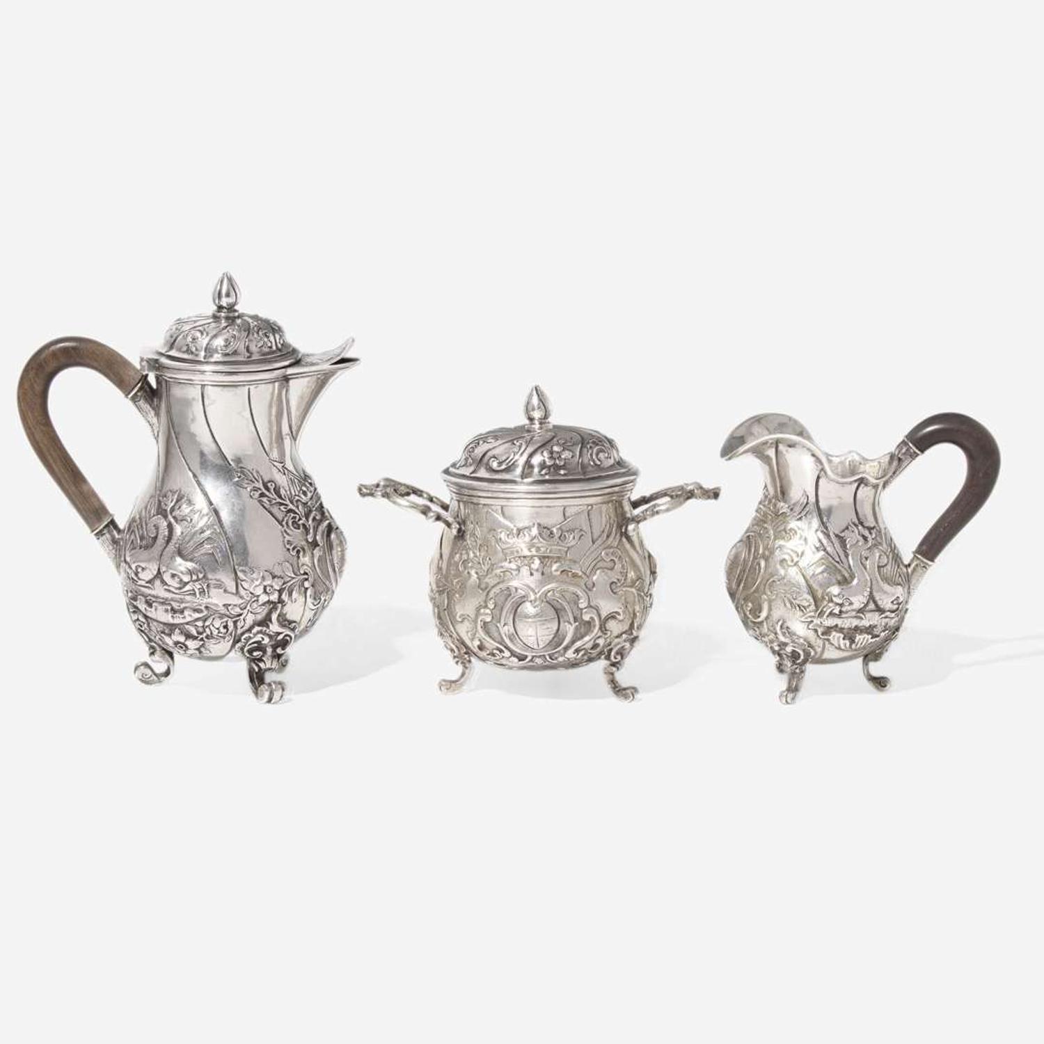 A miniature Continental silver repoussé three-piece coffee service, probably 19th century