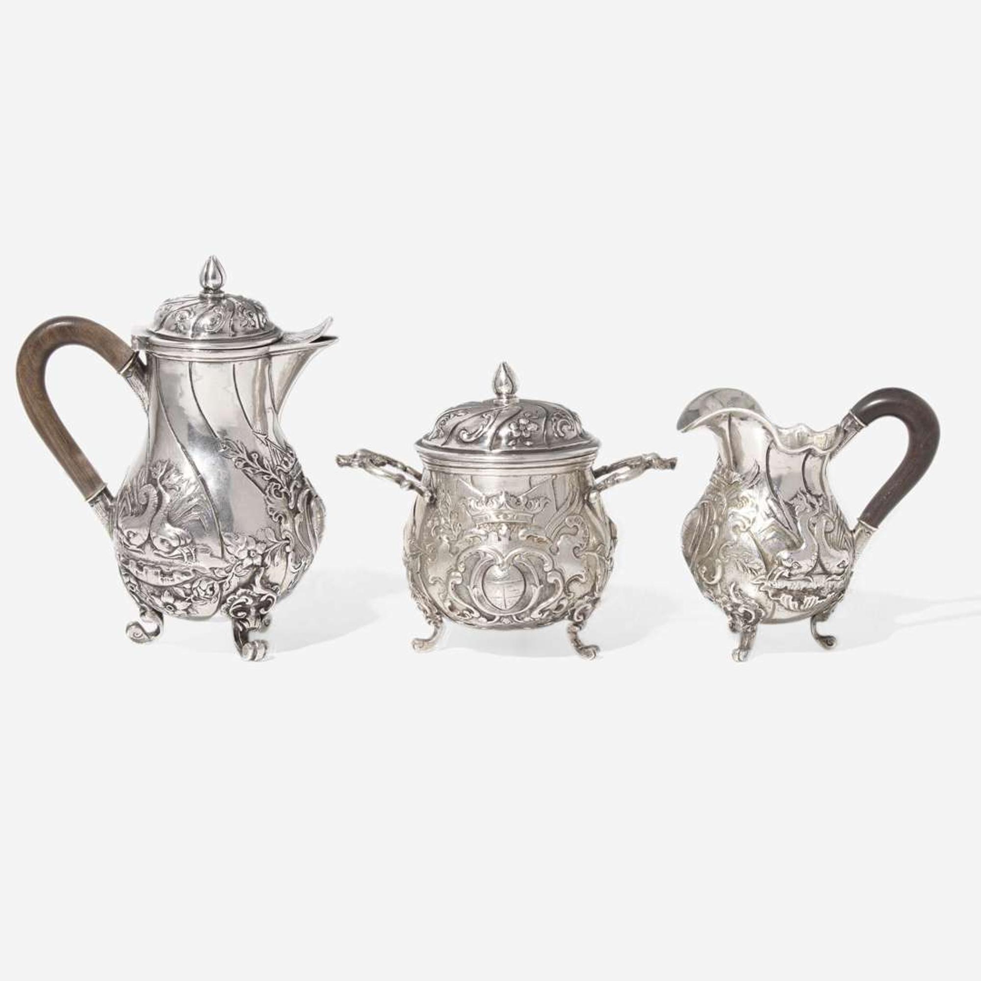 A miniature Continental silver repoussé three-piece coffee service, probably 19th century