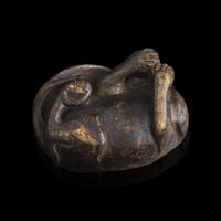 A Chinese Patinated Bronze Figure of a Stylized Lion, Late Ming-Early Qing Dynasty — 明末清初 銅獅鎮紙