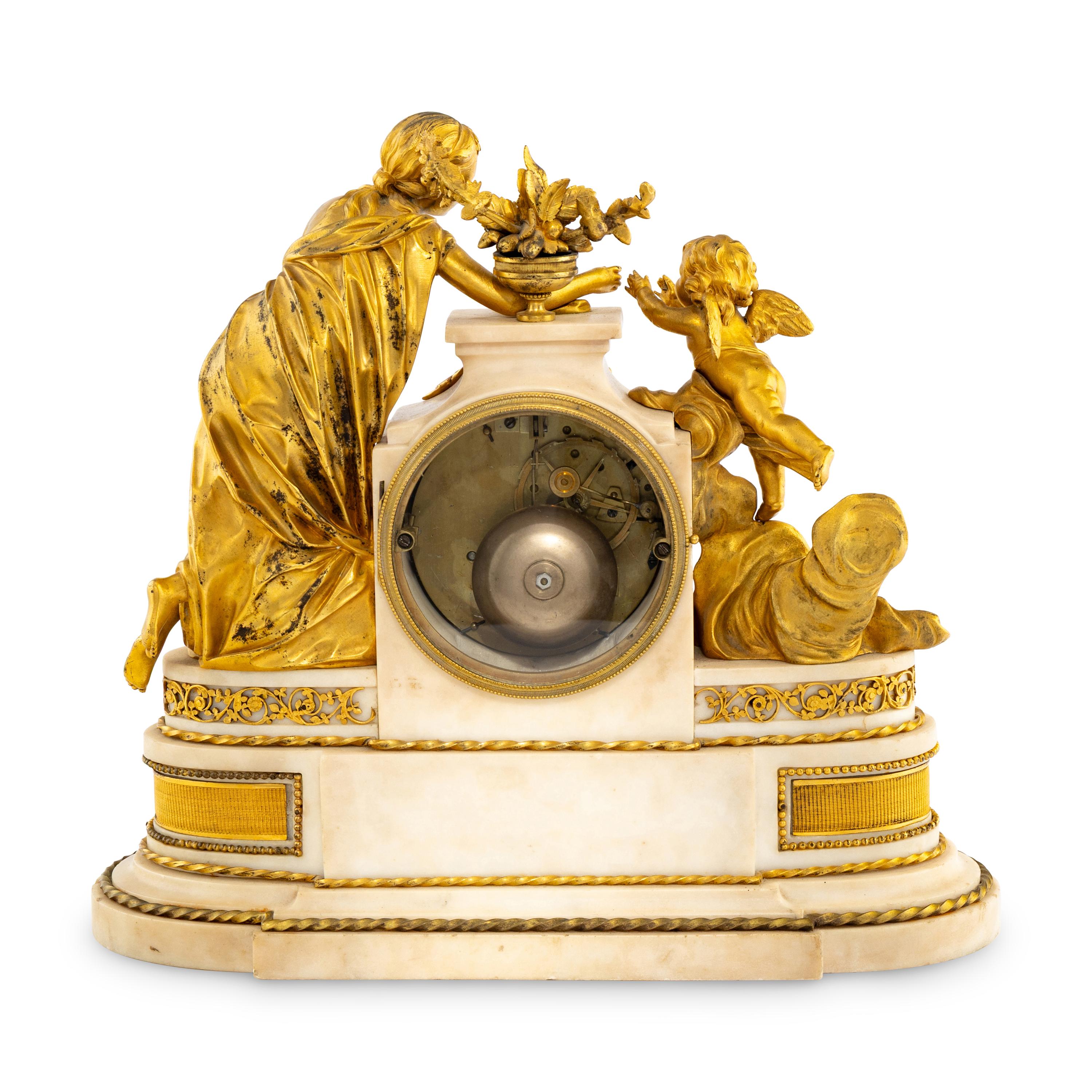 A Louis XVI Style Gilt Bronze and Marble Mantel Clock