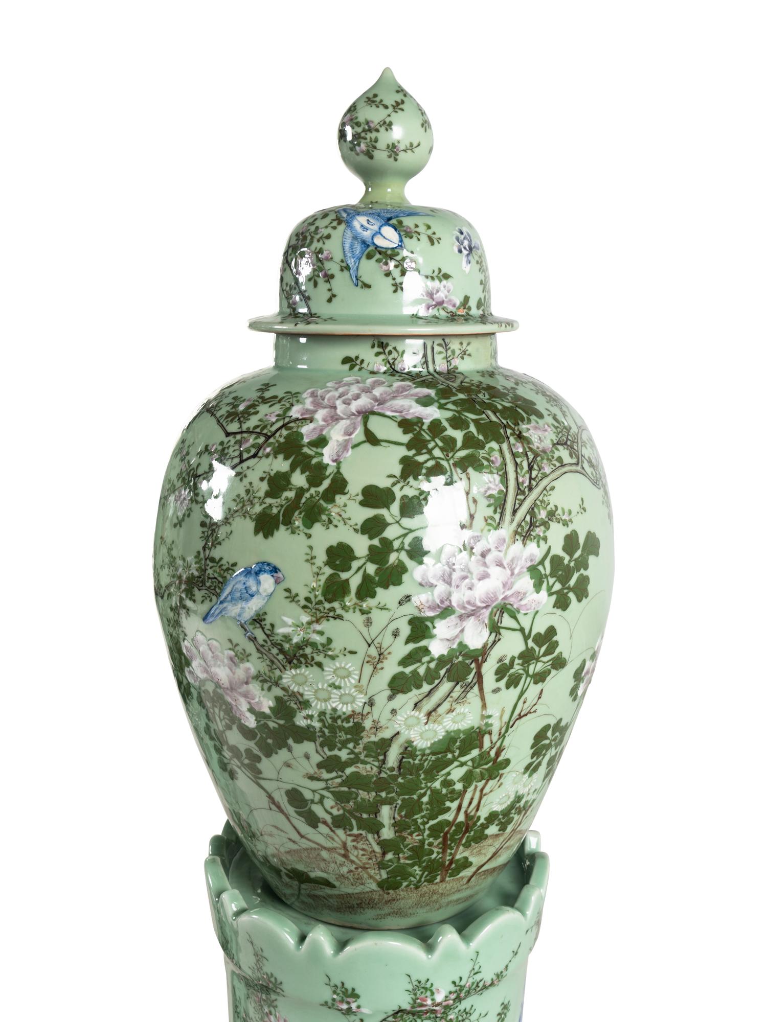 A Pair of Chinese Large Porcelain Covered Urns on Pedestals