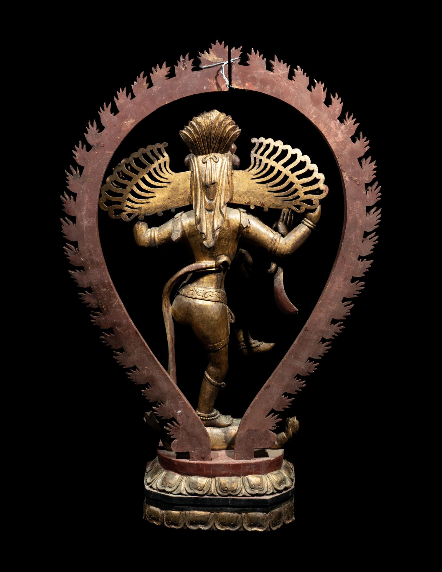 A Large Gilt and Red Lacquered Wood Figure of a Dancing Deity