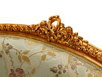 A Pair of Louis XV Style Giltwood Petit Canapes