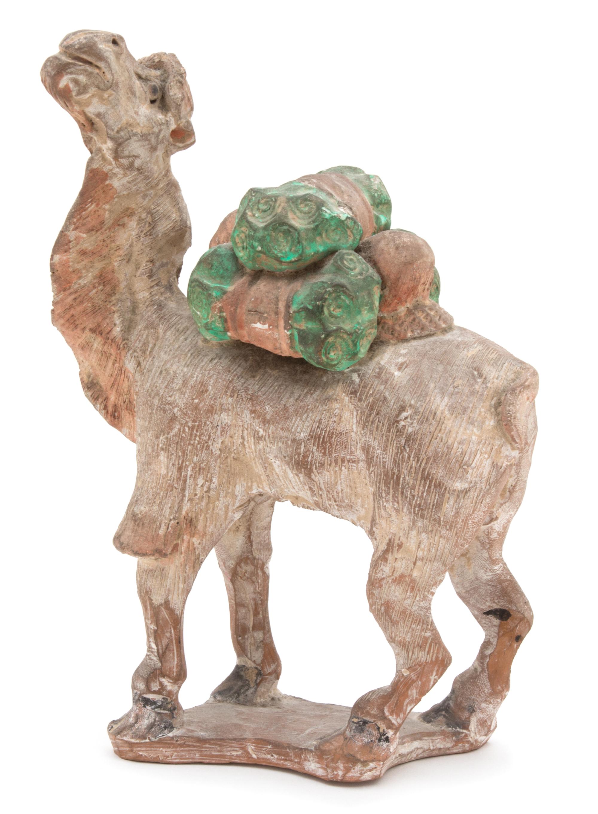 An Egyptian Painted Pottery Figure of a Camel Height 8 1/4 inches. — 20TH CENTURY