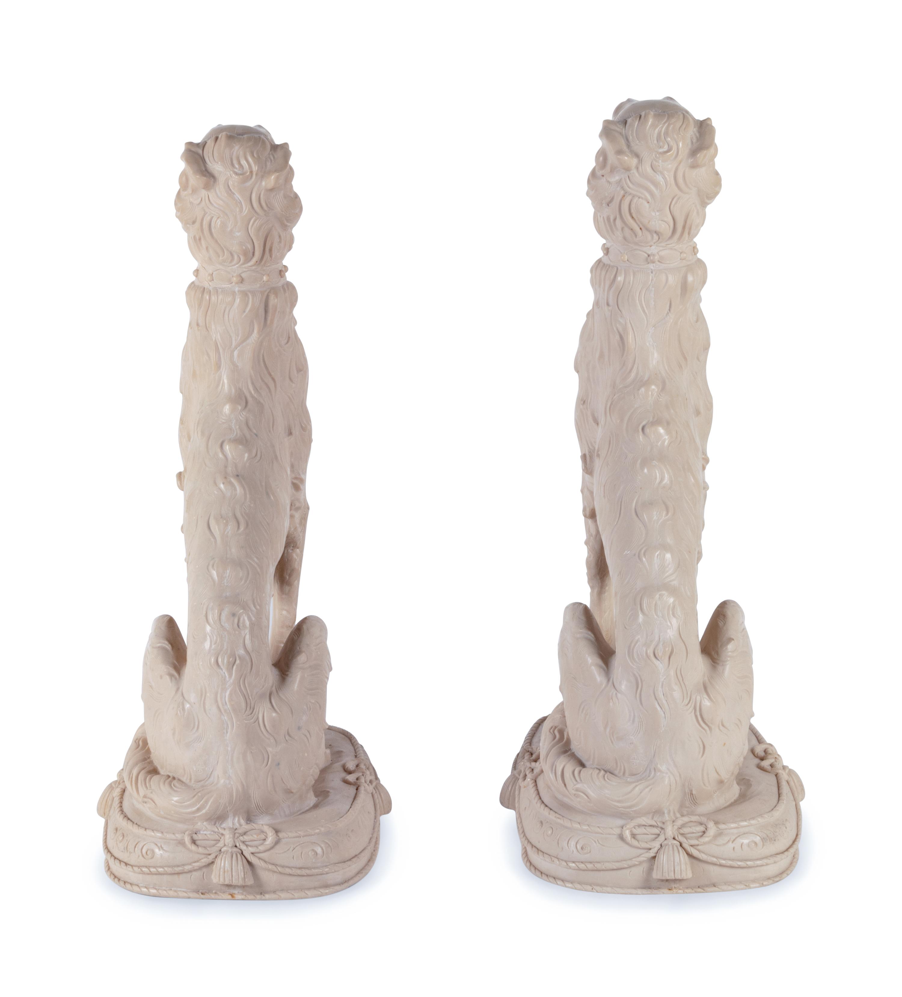 A Pair of Resin Models of Seated Hounds