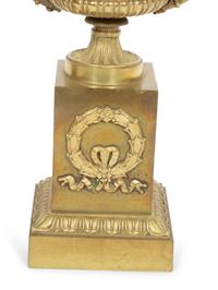 A Pair of Empire Gilt Bronze Urns on Pedestal Bases