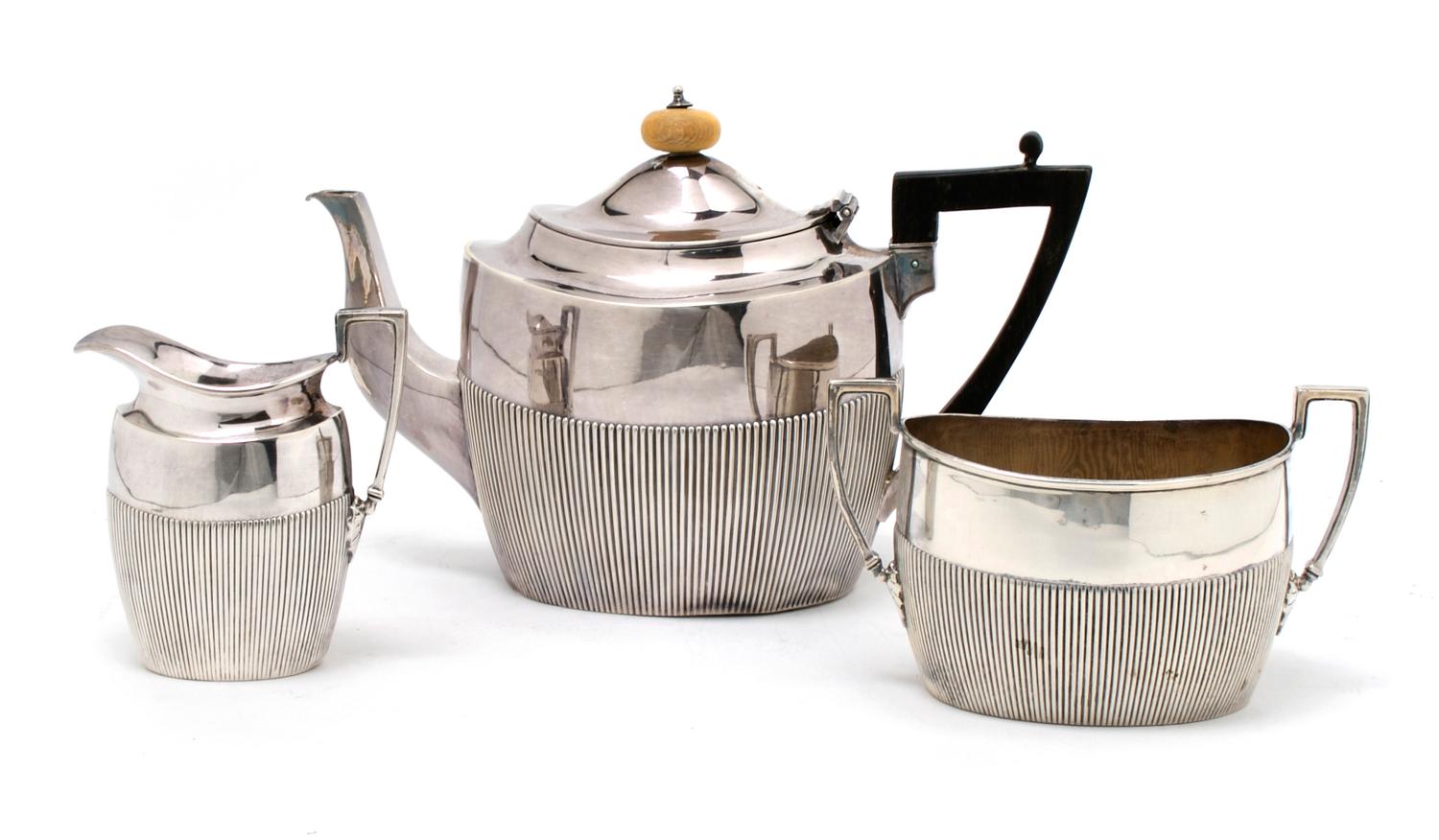 An English Silver Three Piece Tea Set, James Dixon and Sons, Height of tallest 5 3/4 inches.
