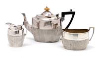 An English Silver Three Piece Tea Set, James Dixon and Sons, Height of tallest 5 3/4 inches.