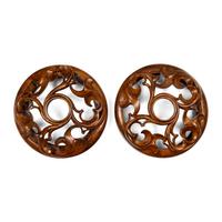A Pair of Carved Oak Roundels