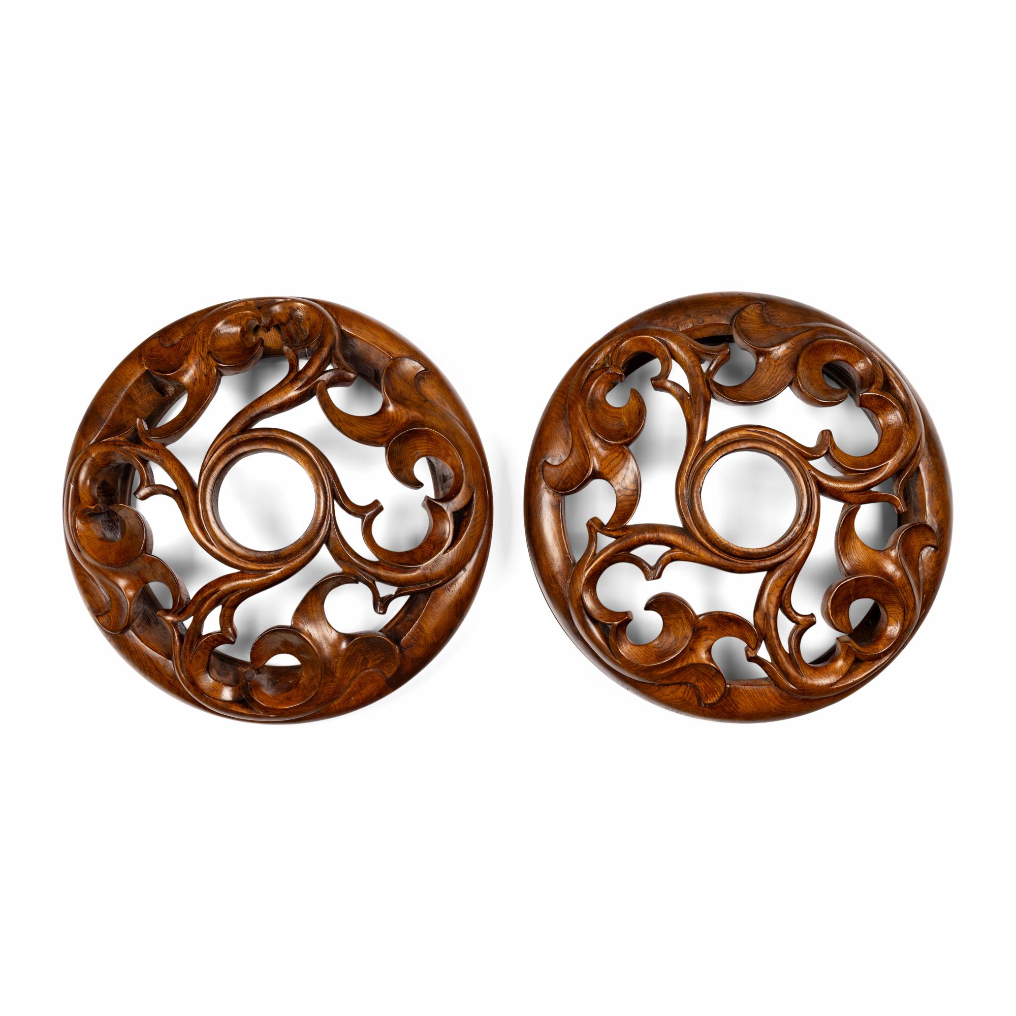 A Pair of Carved Oak Roundels