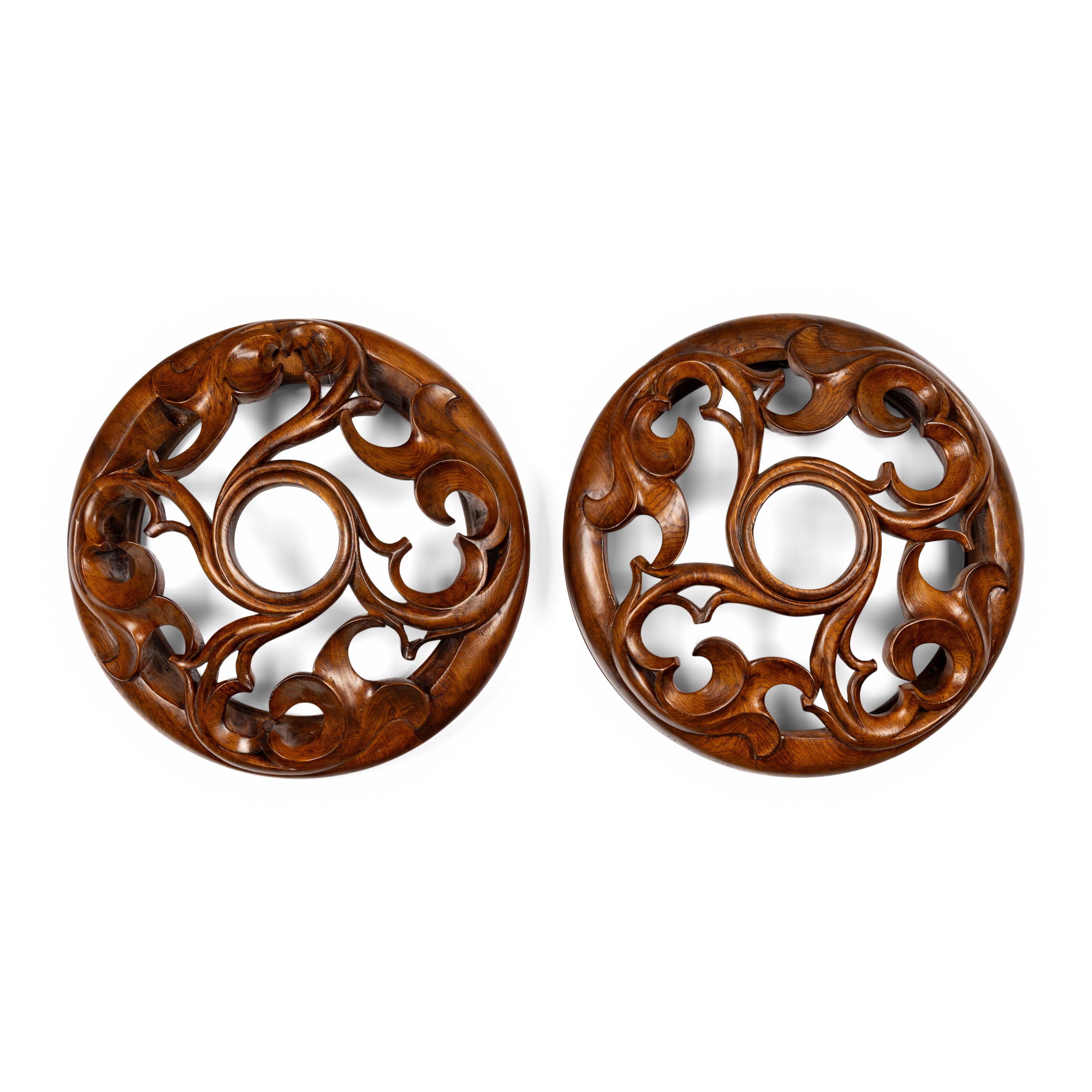 A Pair of Carved Oak Roundels