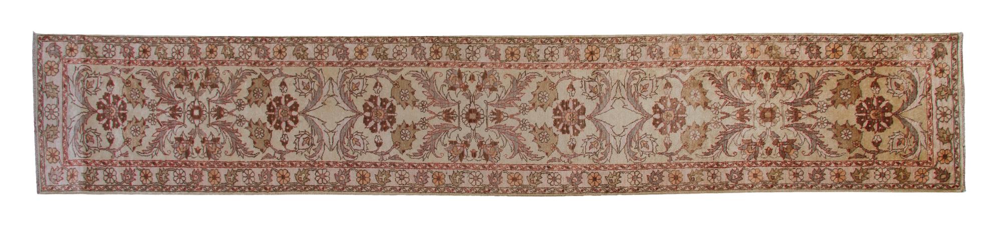 A Persian Wool Runner, 14 feet 8 inches x 2 feet 6 inches.