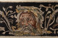 A Roman-Style Polychrome Mosaic Panel with a Bearded Head and Two Animals