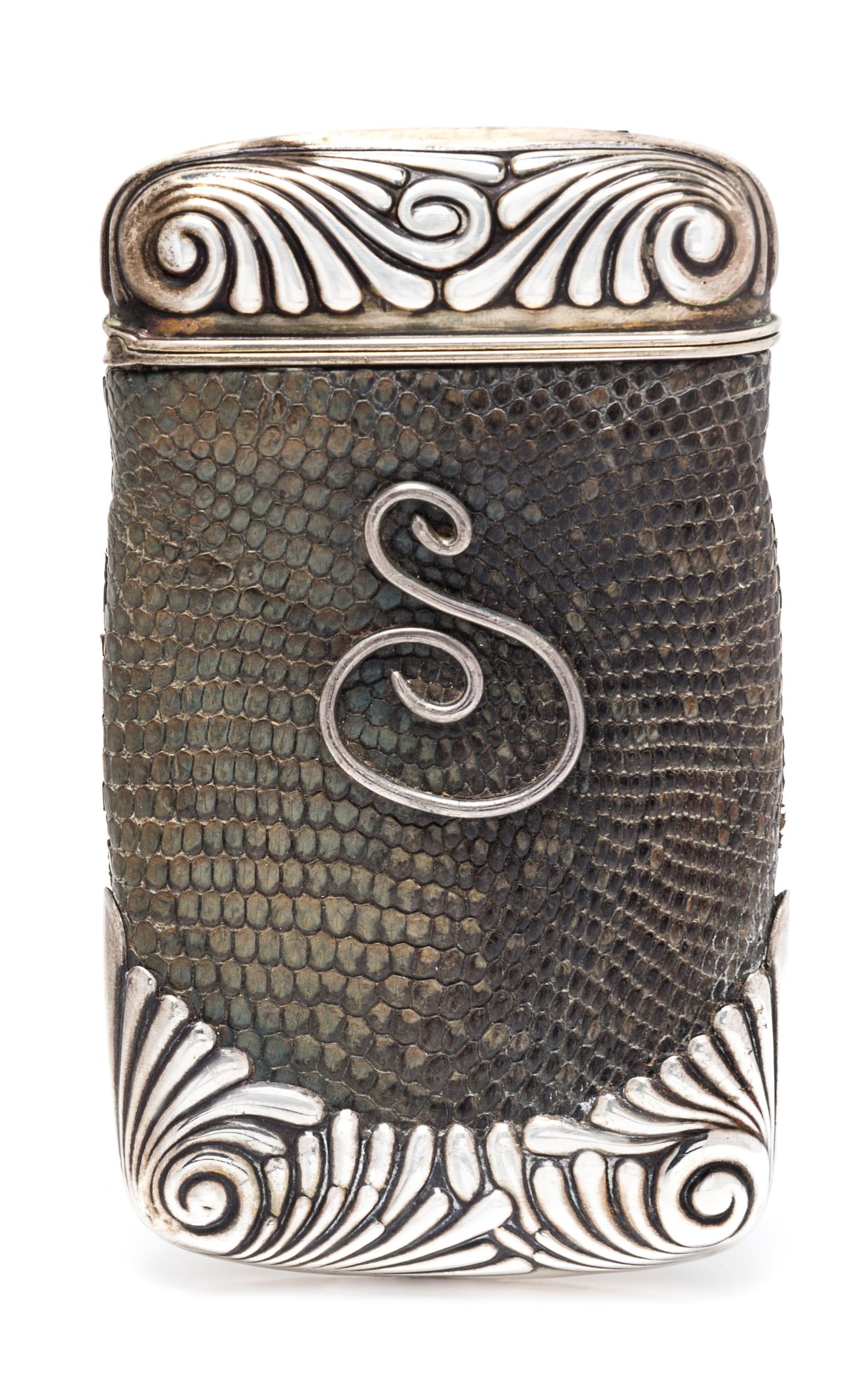 An American Silver and Lizard Skin Cigar Case, Gorham Mfg. Co., Providence, RI, 1888, the case ends worked with fluted volutes, the liz