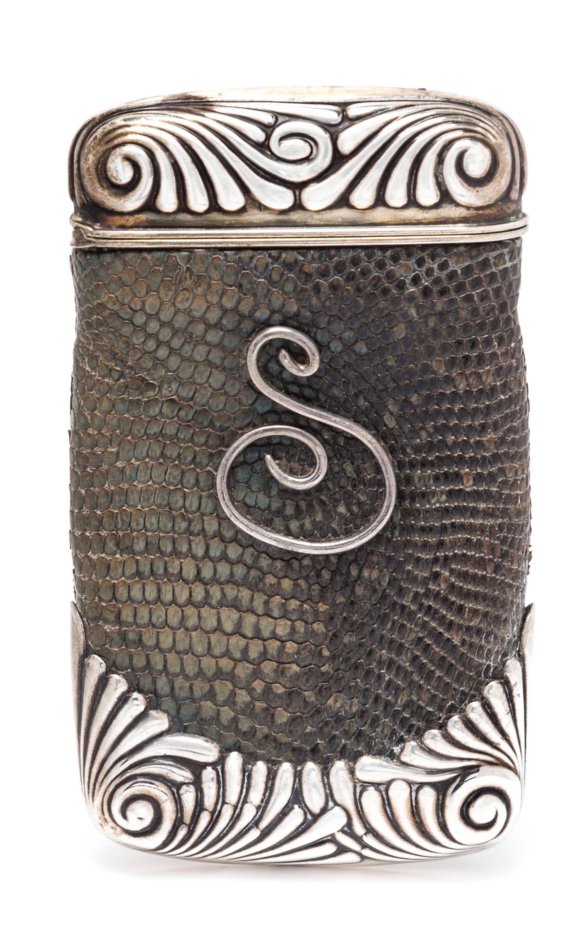 An American Silver and Lizard Skin Cigar Case, Gorham Mfg. Co., Providence, RI, 1888, the case ends worked with fluted volutes, the liz