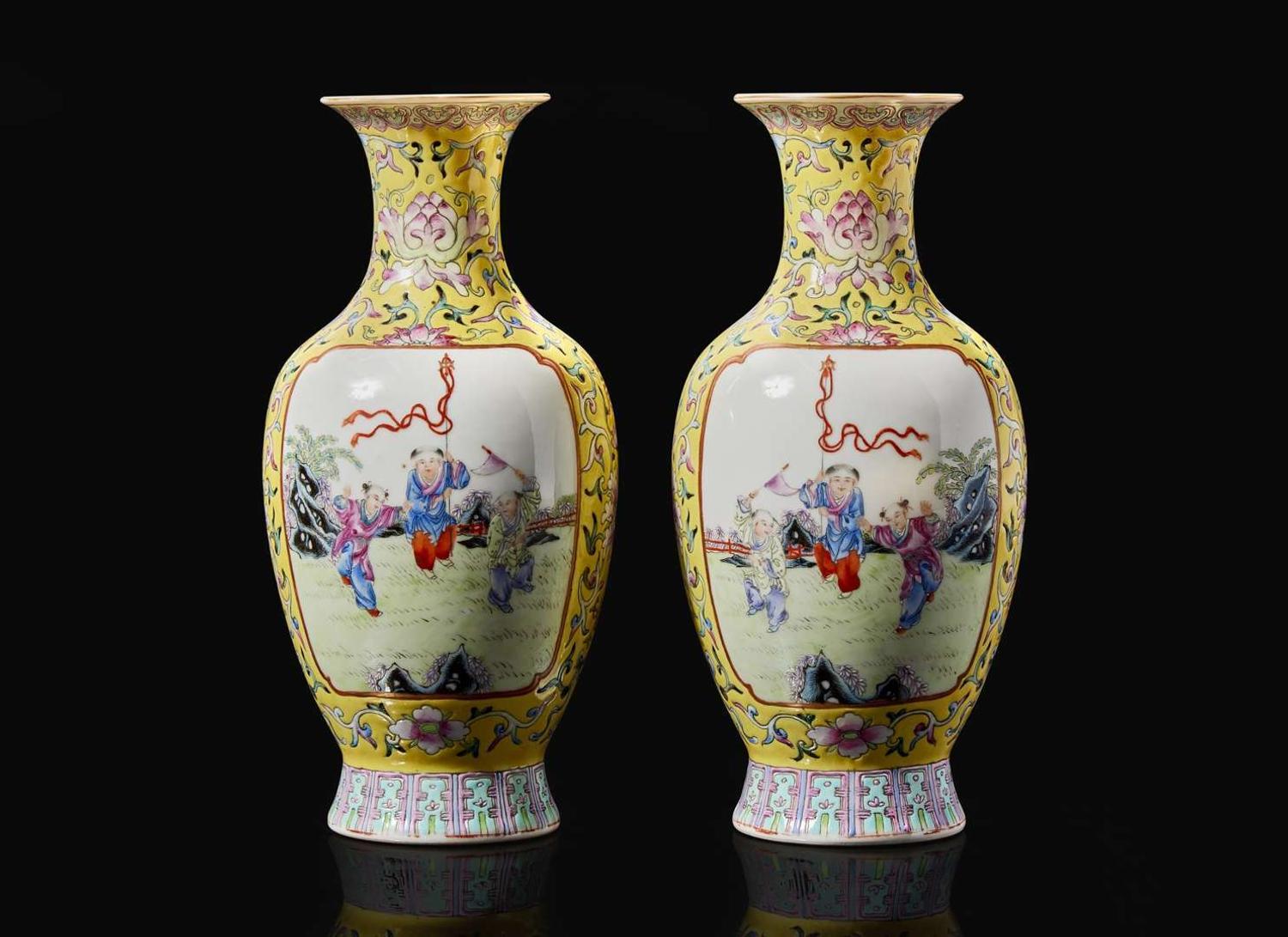 A pair of Chinese famille rose decorated yellow-ground “Boys” vases, 20th Century 黃地粉彩嬰戲盌一對 二十世紀