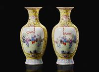 A pair of Chinese famille rose decorated yellow-ground “Boys” vases, 20th Century 黃地粉彩嬰戲盌一對 二十世紀