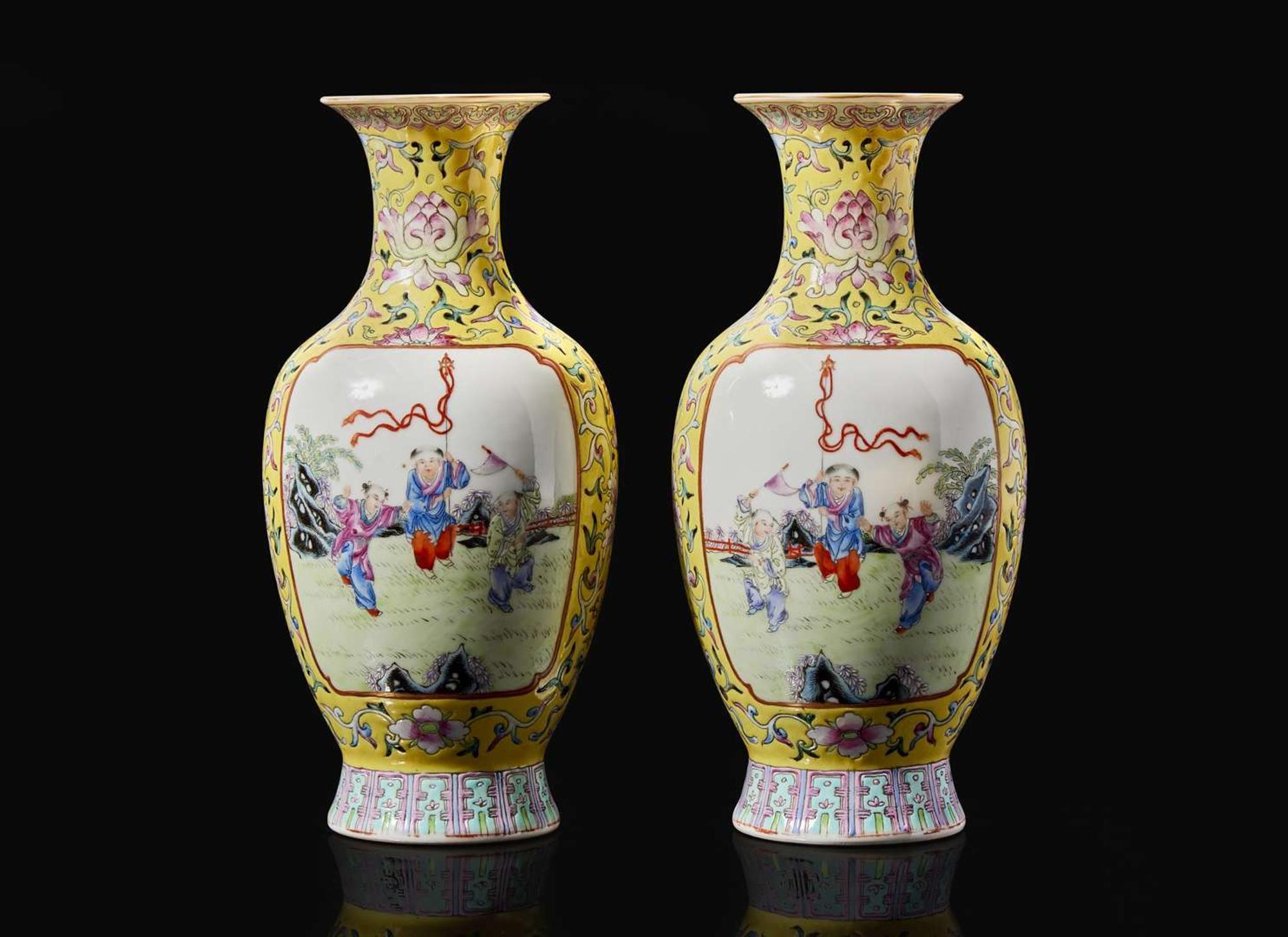 A pair of Chinese famille rose decorated yellow-ground “Boys” vases, 20th Century 黃地粉彩嬰戲盌一對 二十世紀