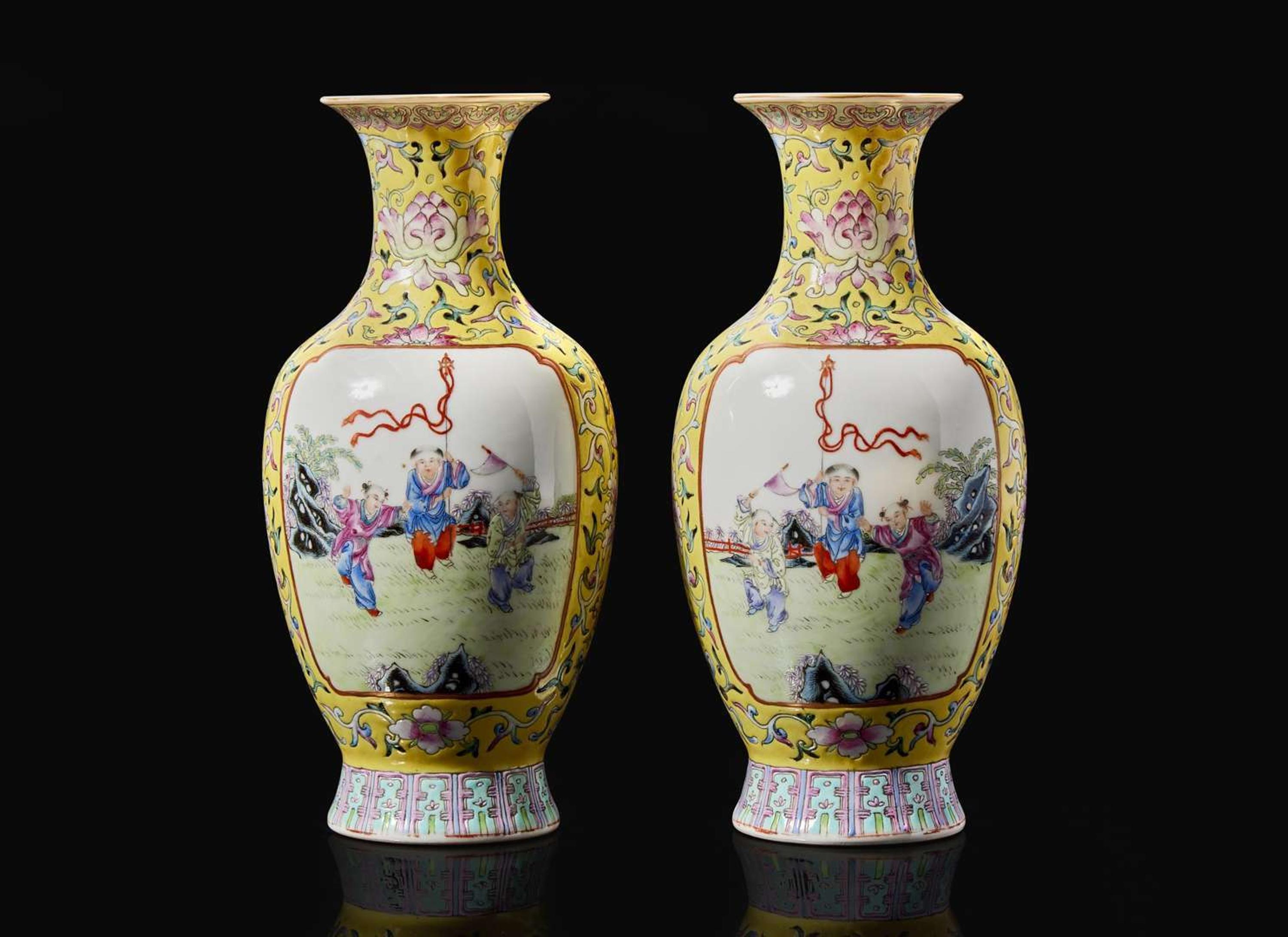 A pair of Chinese famille rose decorated yellow-ground “Boys” vases, 20th Century 黃地粉彩嬰戲盌一對 二十世紀