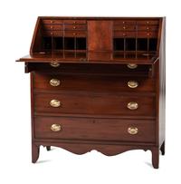 A Chippendale Cherrywood Slant-Front Chest of Drawers