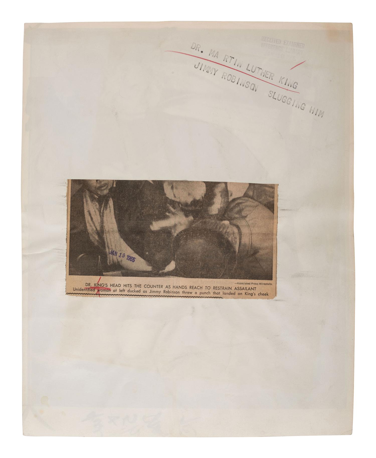 [KING, Martin Luther, Jr. (1929-1968)]. Press photograph of Dr. King being attacked at the Hotel Albert in Selma, AL. 18 January 1965.