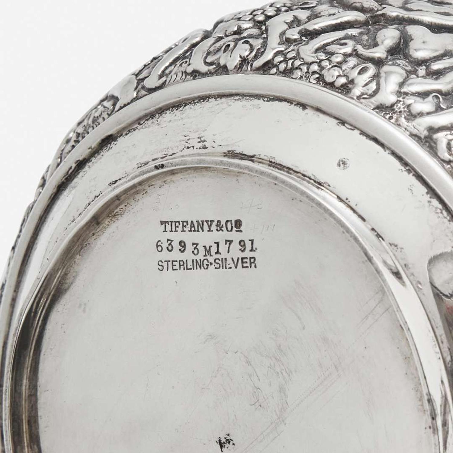 A three-piece sterling silver repoussé tea service Tiffany & Co., New York, NY, 1870-1891