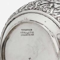 A three-piece sterling silver repoussé tea service Tiffany & Co., New York, NY, 1870-1891