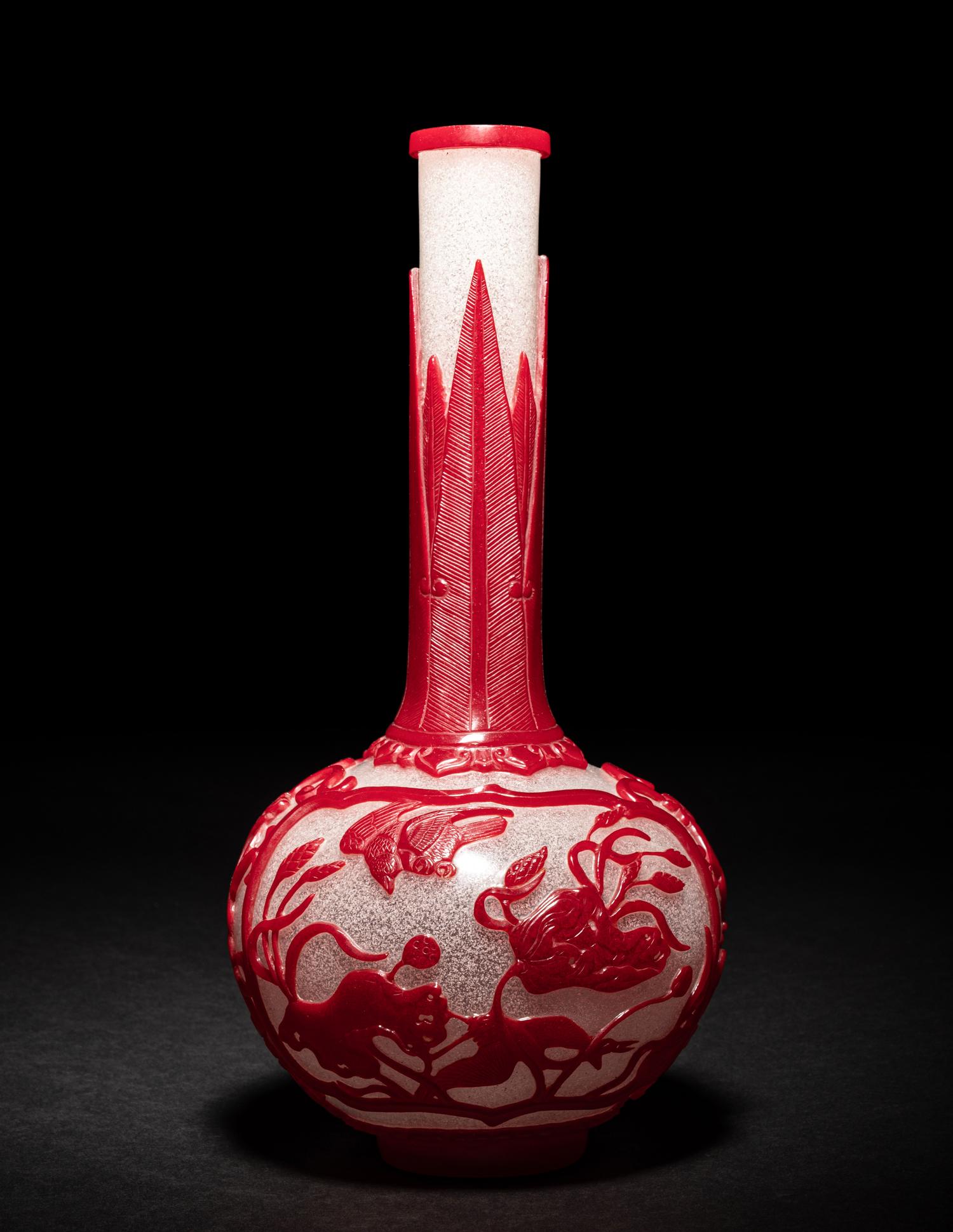 A Chinese Red Overlay Snowflake Ground Peking Glass Bottle Vase