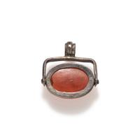 A Roman Carnelian Scaraboid with a Muse — Set in a silver swivel pendant