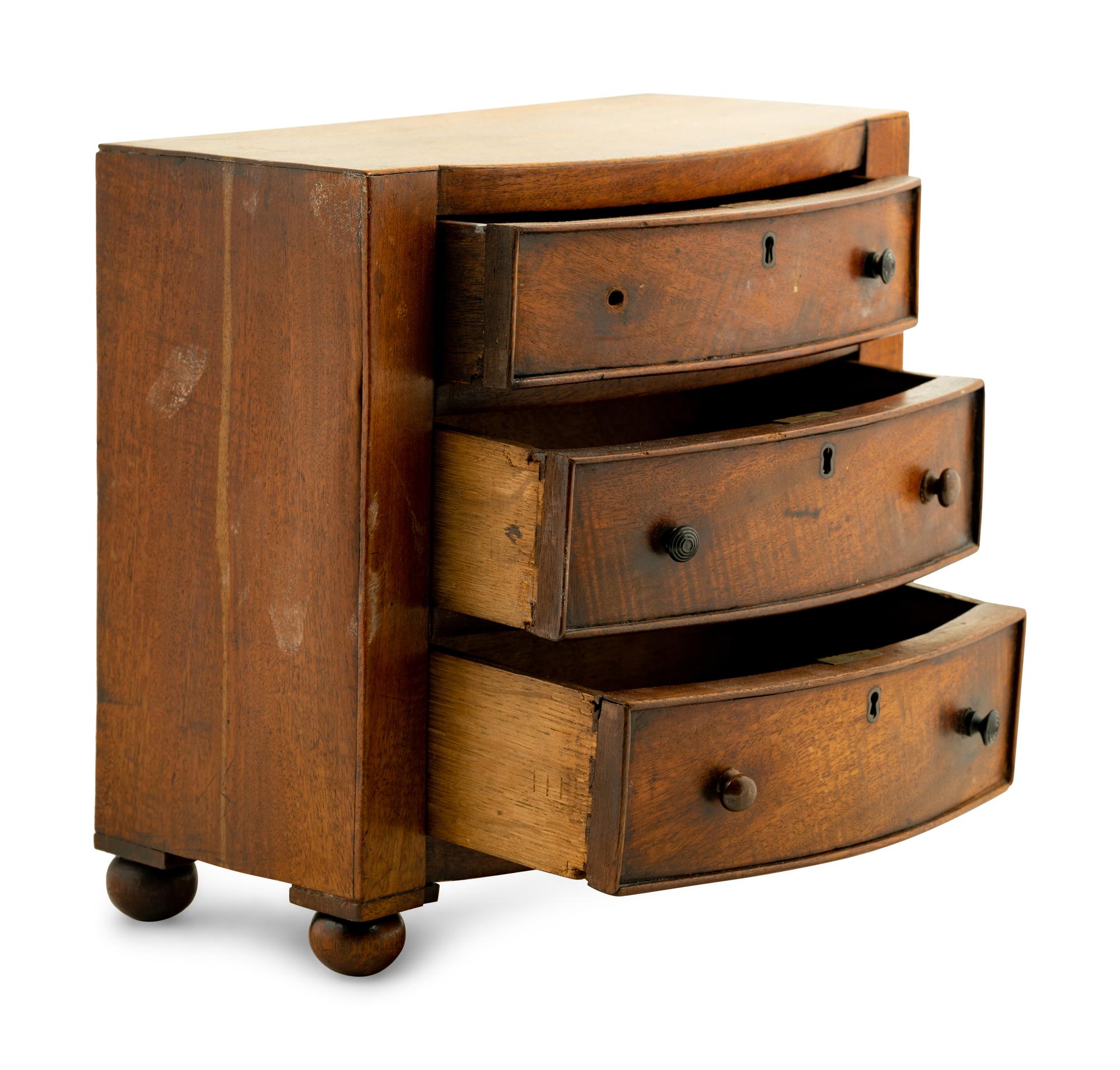 A Regency Mahogany Diminutive Bowfront Chest of Drawers