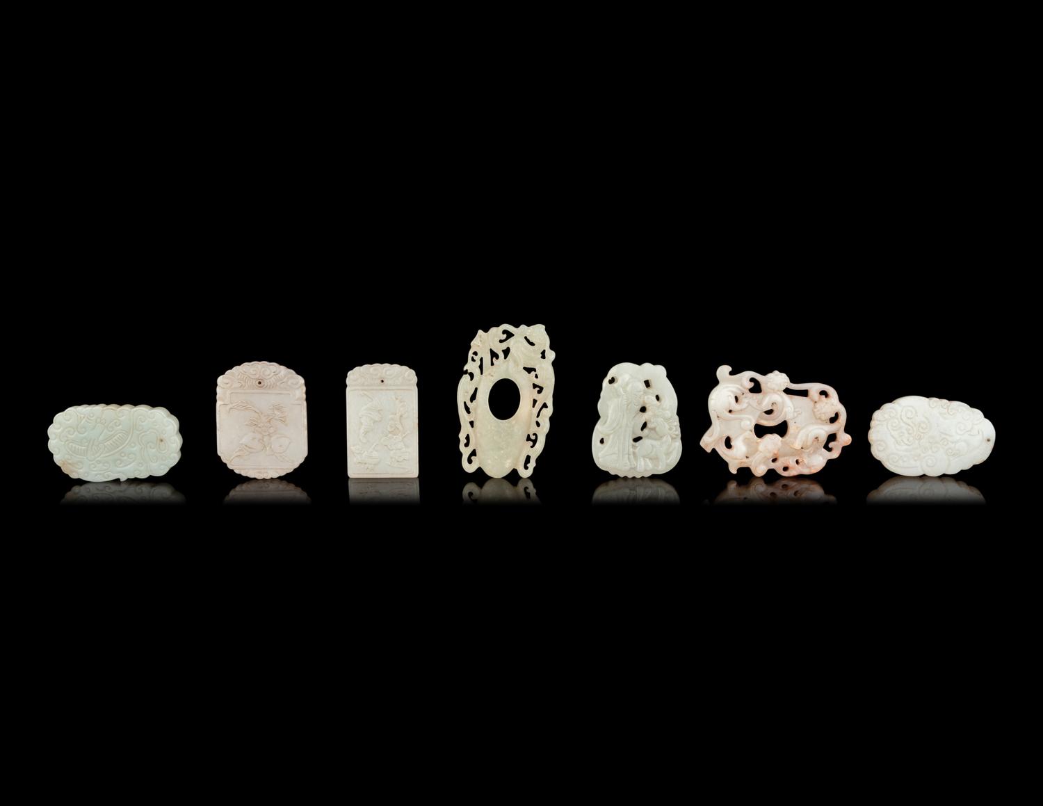 Seven Chinese Carved Celadon Jade Pendants