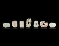 Seven Chinese Carved Celadon Jade Pendants
