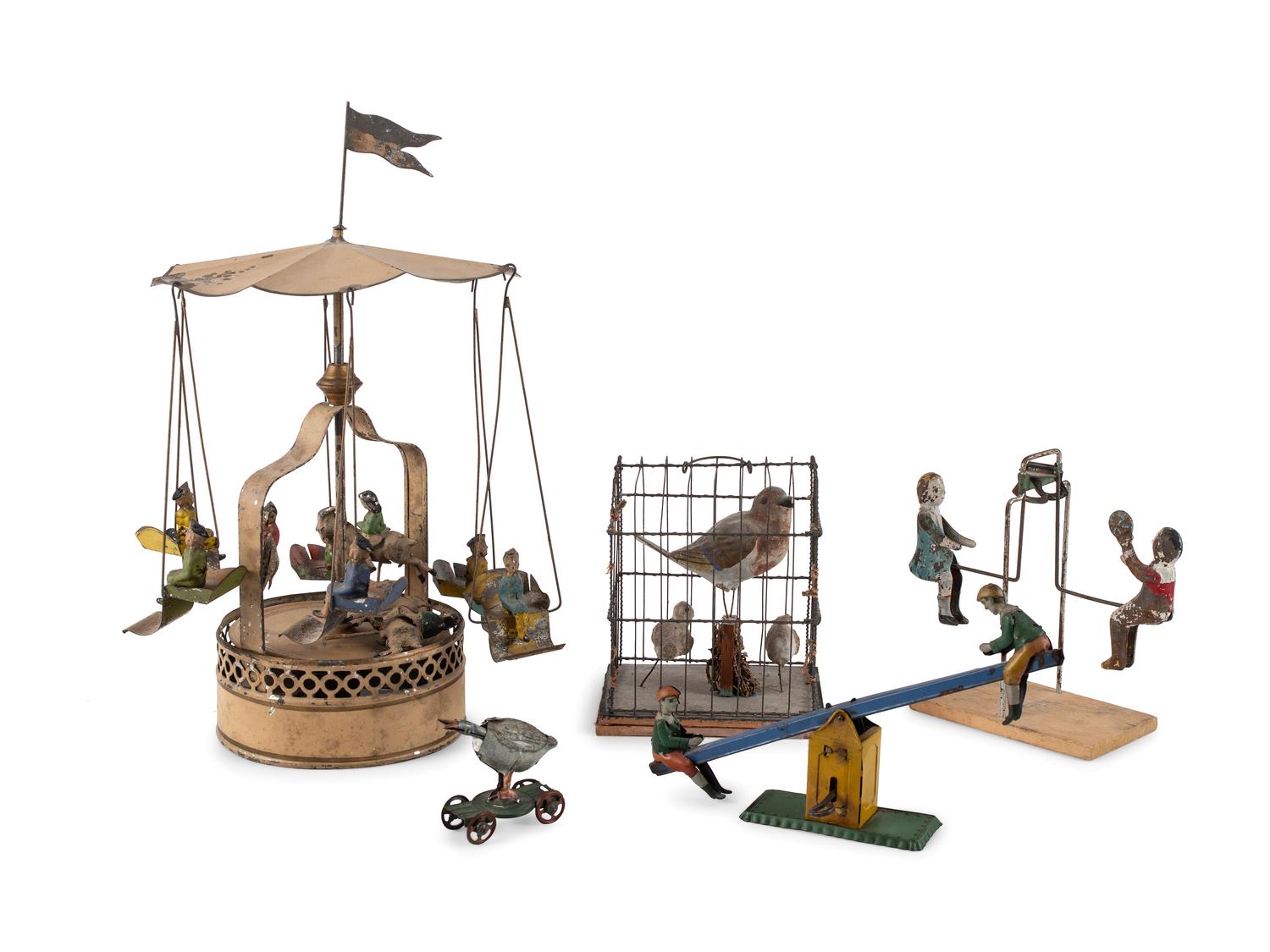 A Group of Tin and Composite Toys