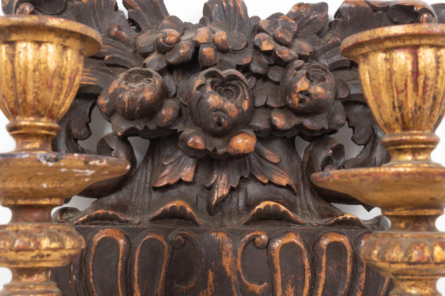 A Pair of French Carved Walnut and Giltwood Two-Light Sconces