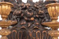 A Pair of French Carved Walnut and Giltwood Two-Light Sconces
