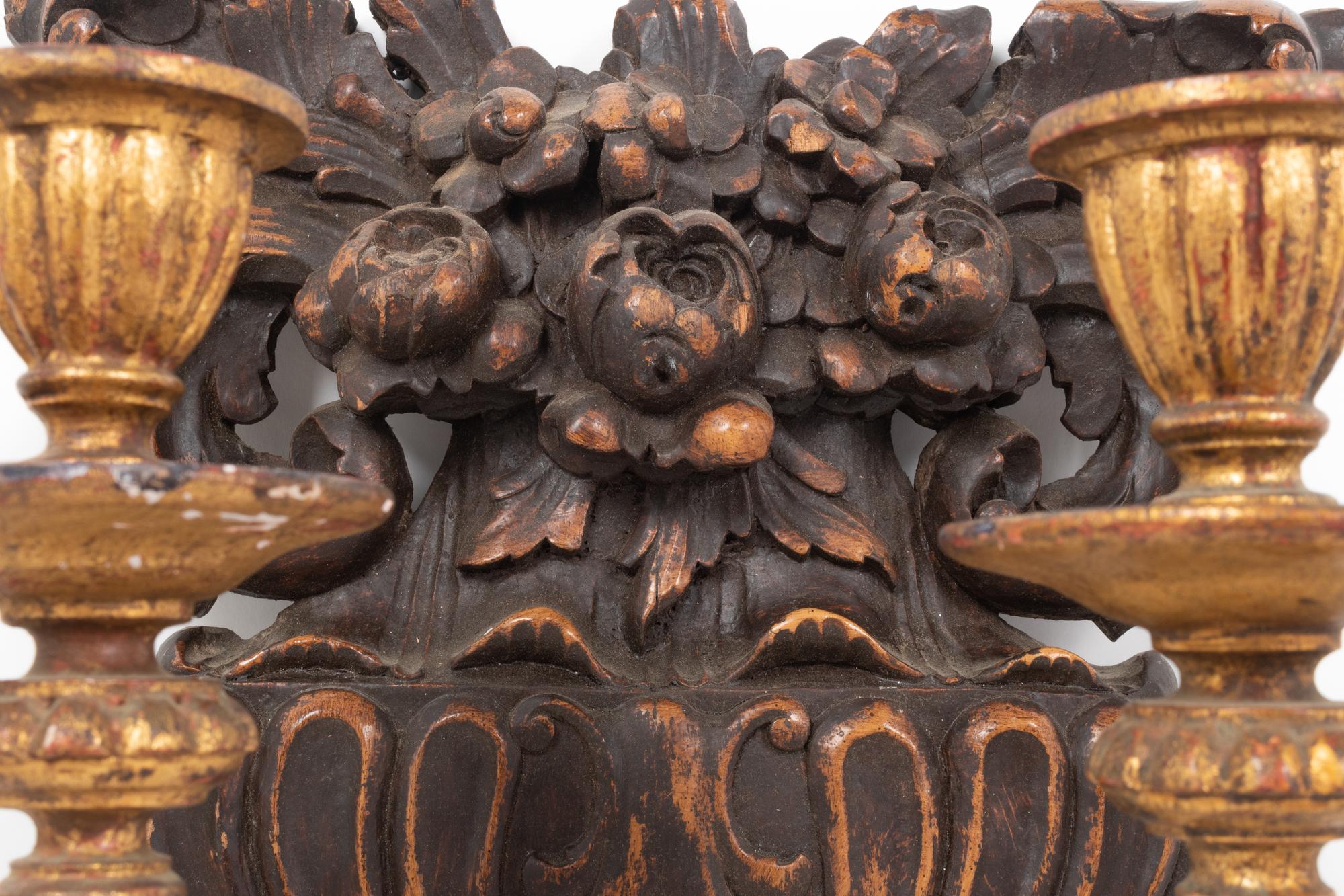 A Pair of French Carved Walnut and Giltwood Two-Light Sconces